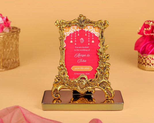 Decorative gold frame with a pink card on a beige background