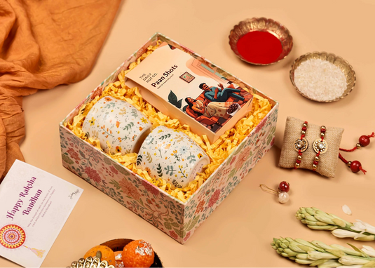 Gift box with traditional items on a beige background